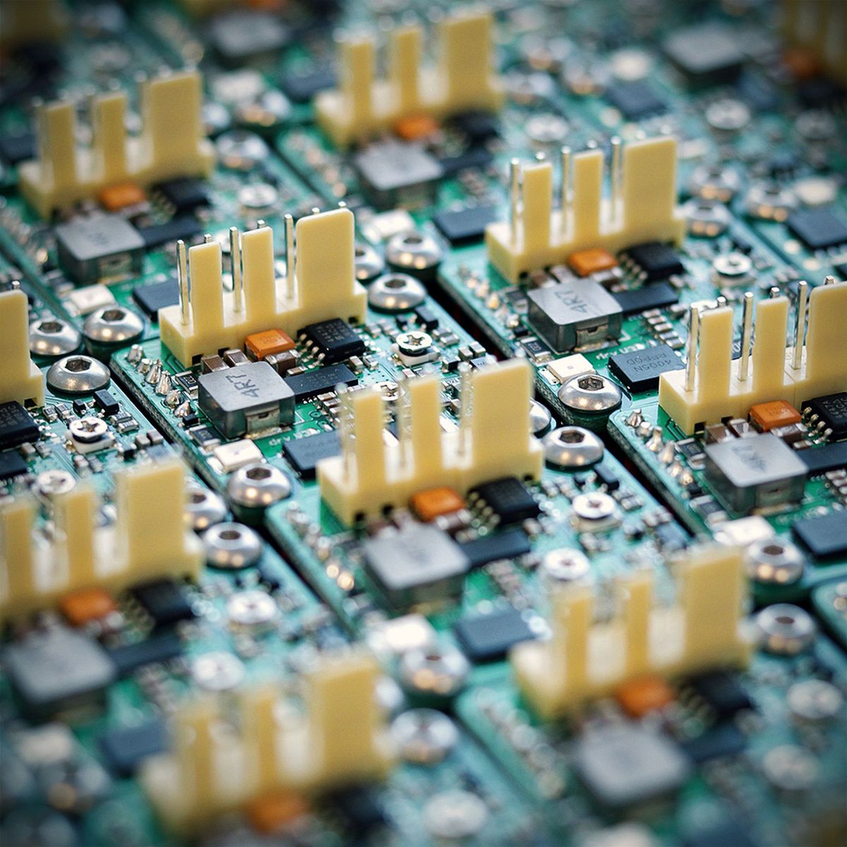 An array of identical connected product circuit boards, each with a connector header and power components